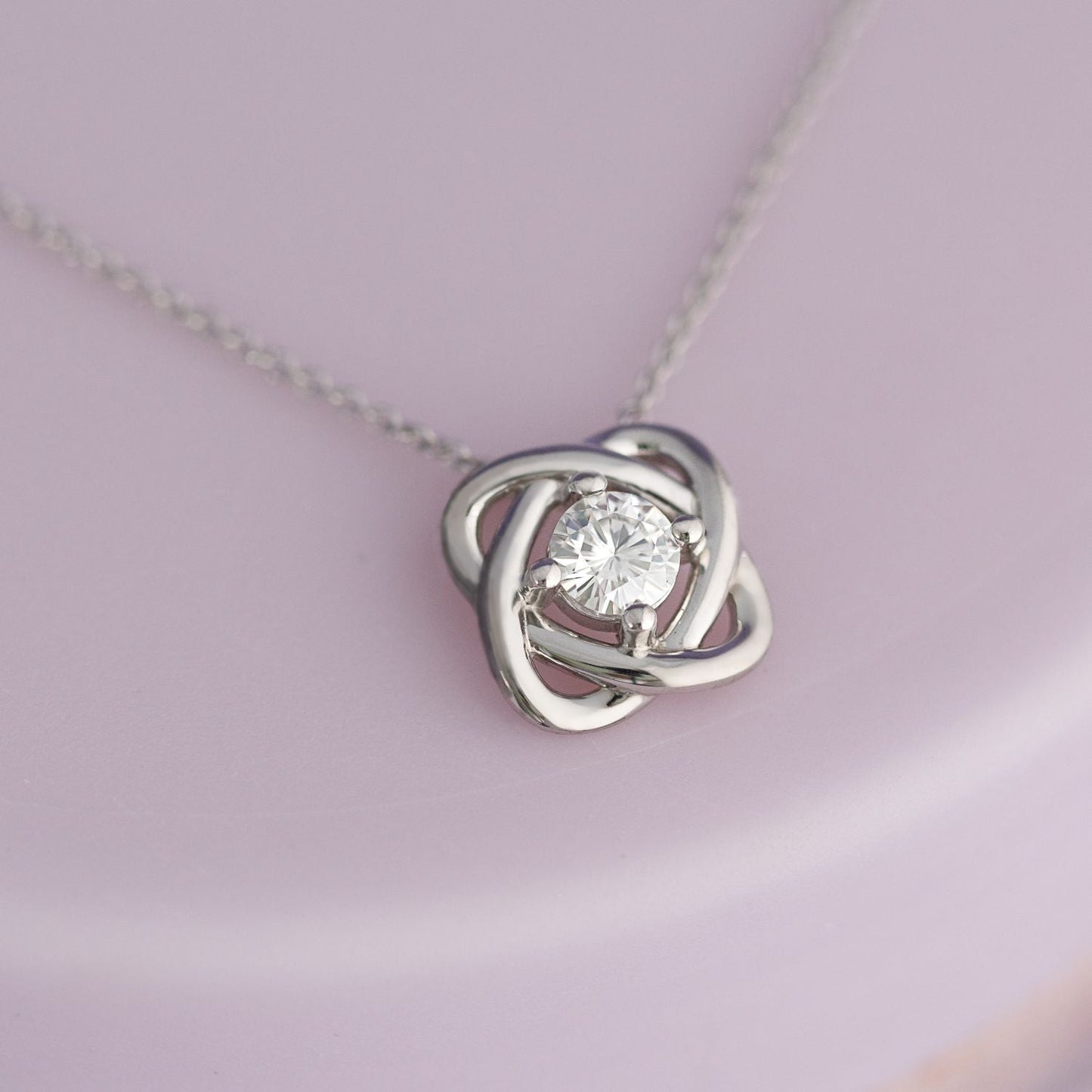 0.33 CTW DEW Round Moissanite Love Knot Pendant in Sterling Silver